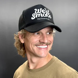 We'd Smoke Trucker Cap in black on a male model